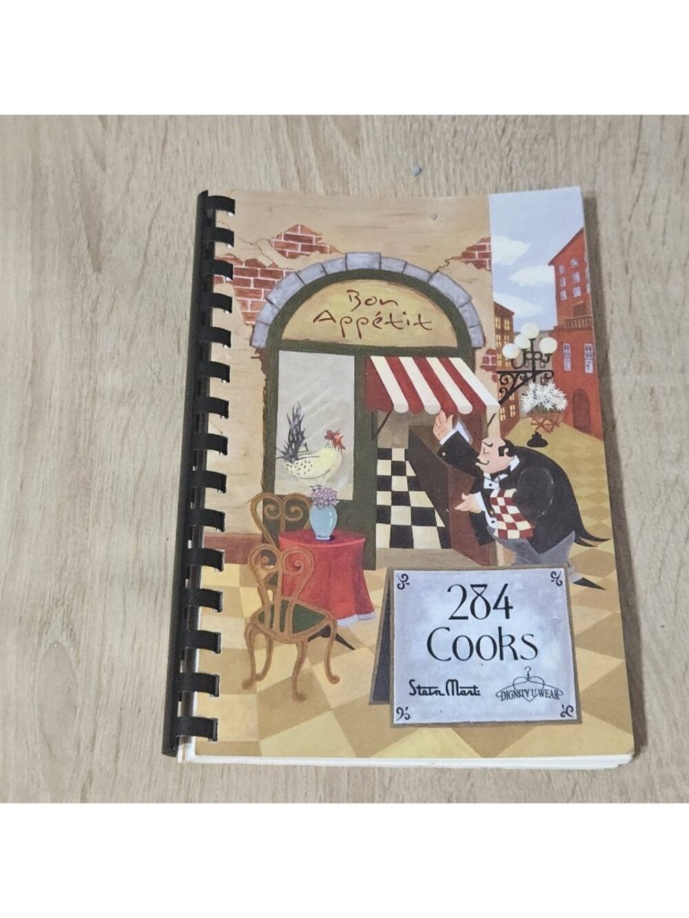 284 Cooks Steinmart/ Dignity U Wear Spiral Bound Cookbook 2005